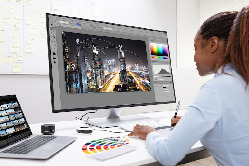 Designer Editing Photos On Computer