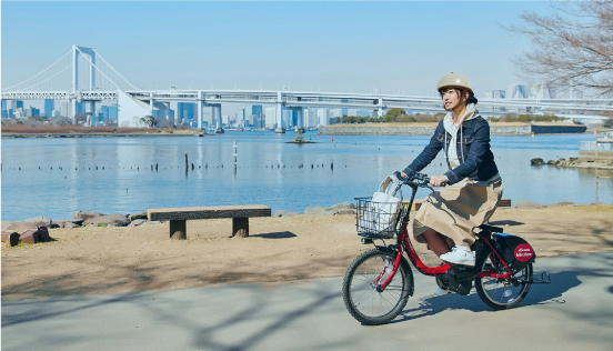 person riding bike by the water