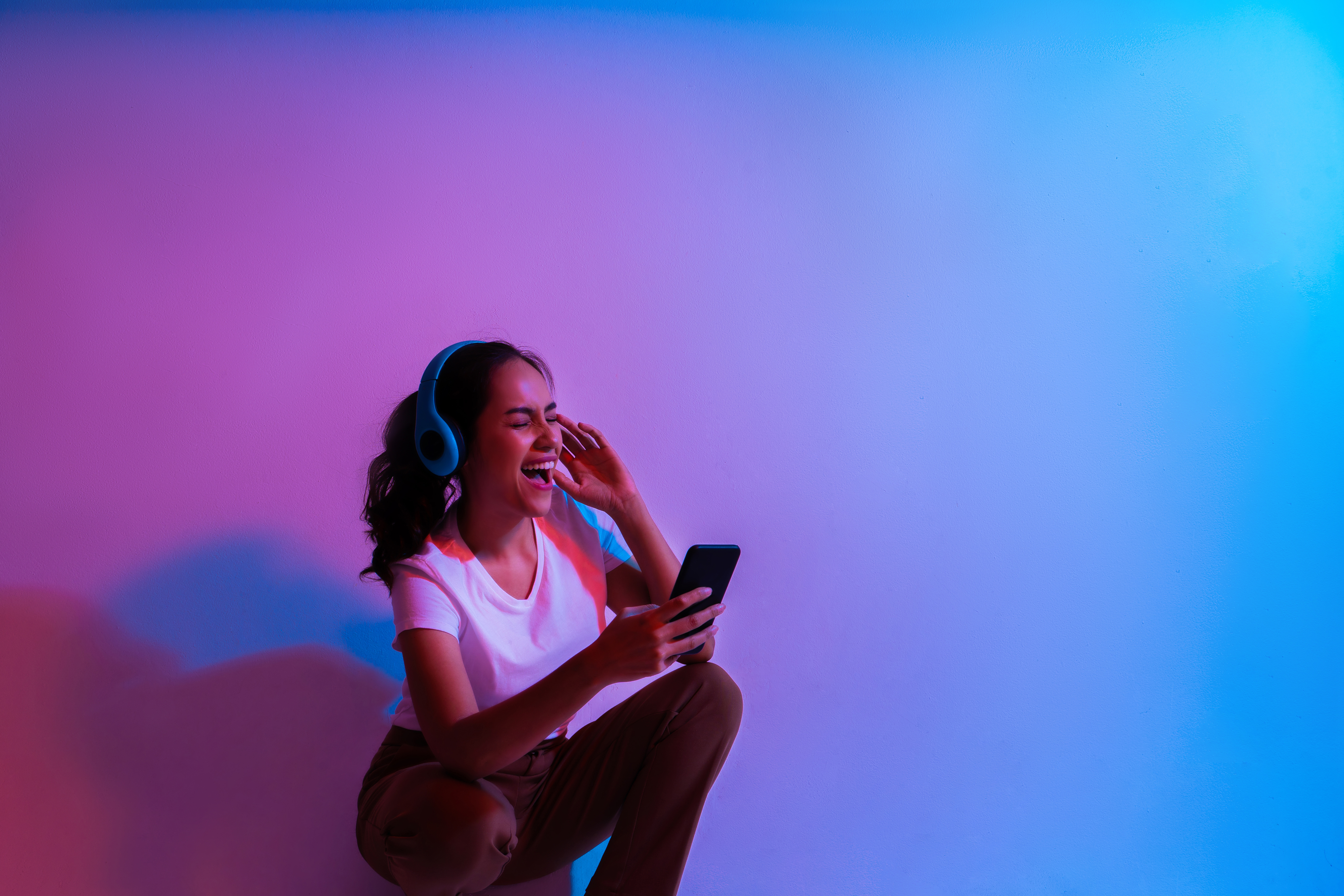 Beautiful asian woman She was happily listening to streaming music. the colorful flash scene