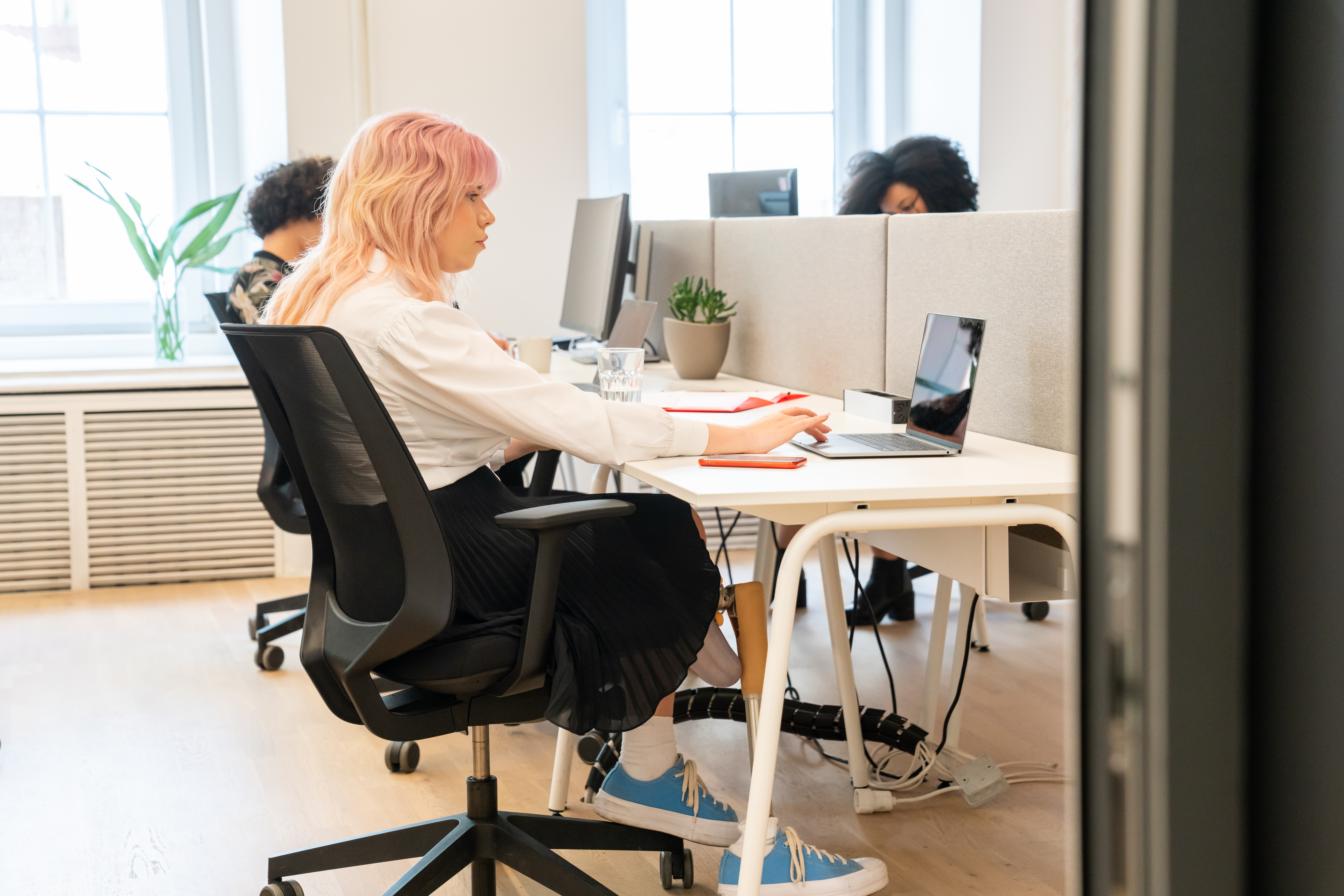 Woman With Leg Disability At Office