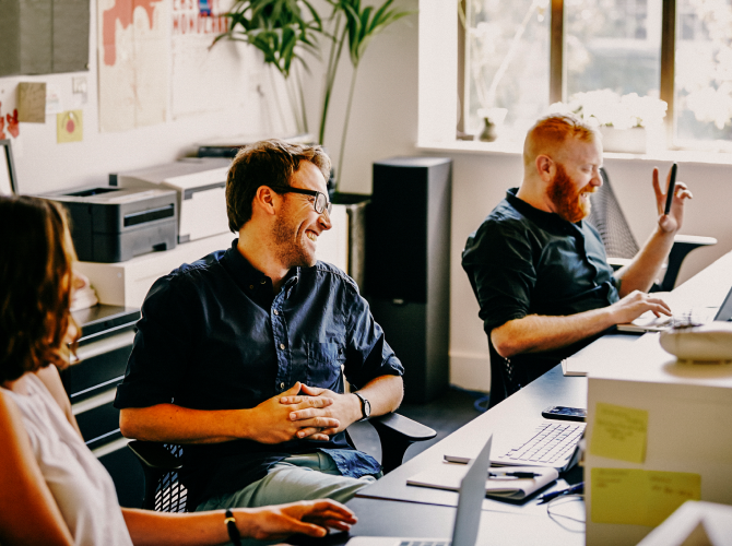 coworkers mingling in an office