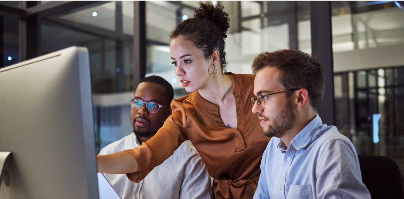 People looking at a computer