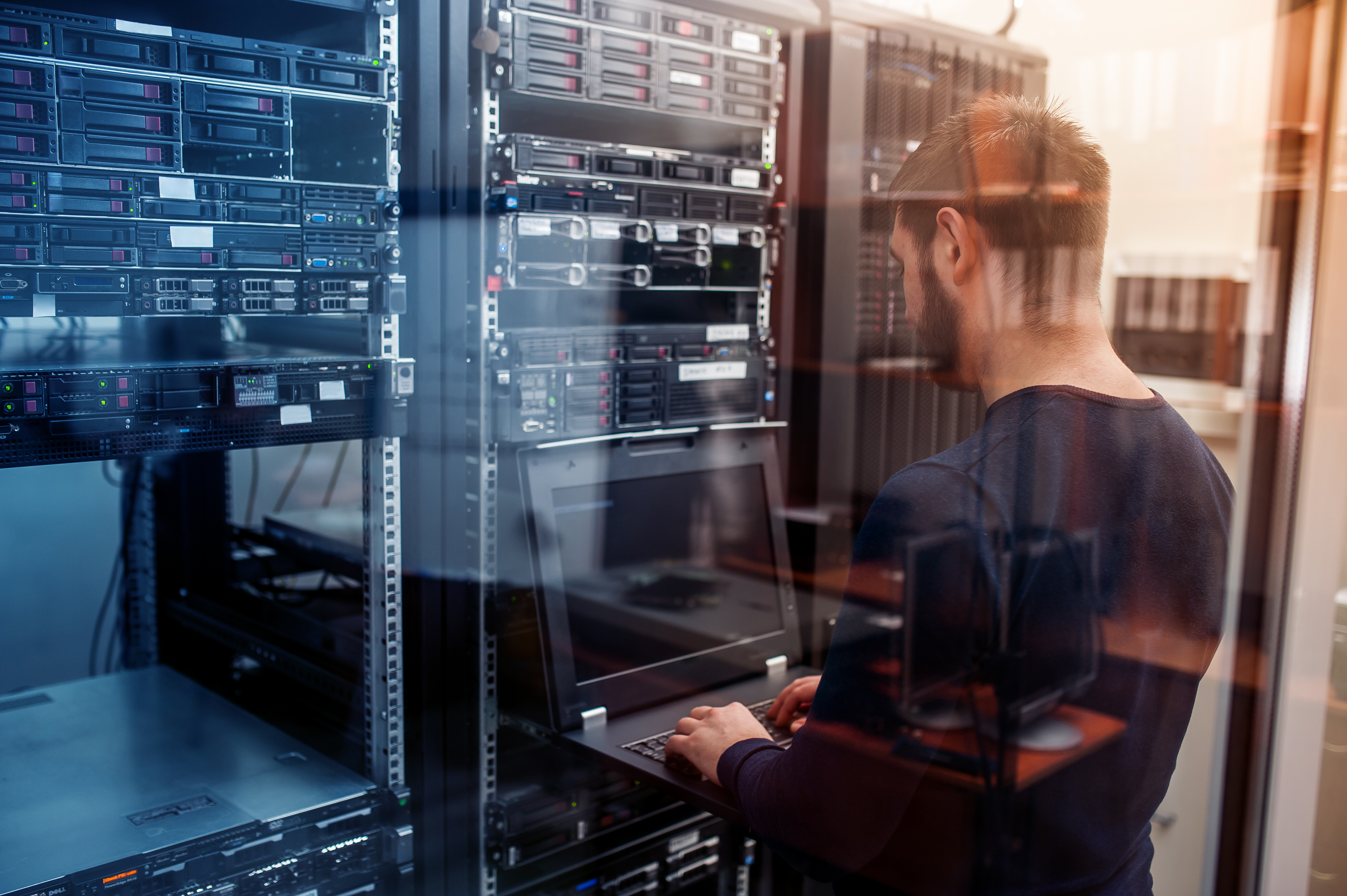 network engineer working in server room