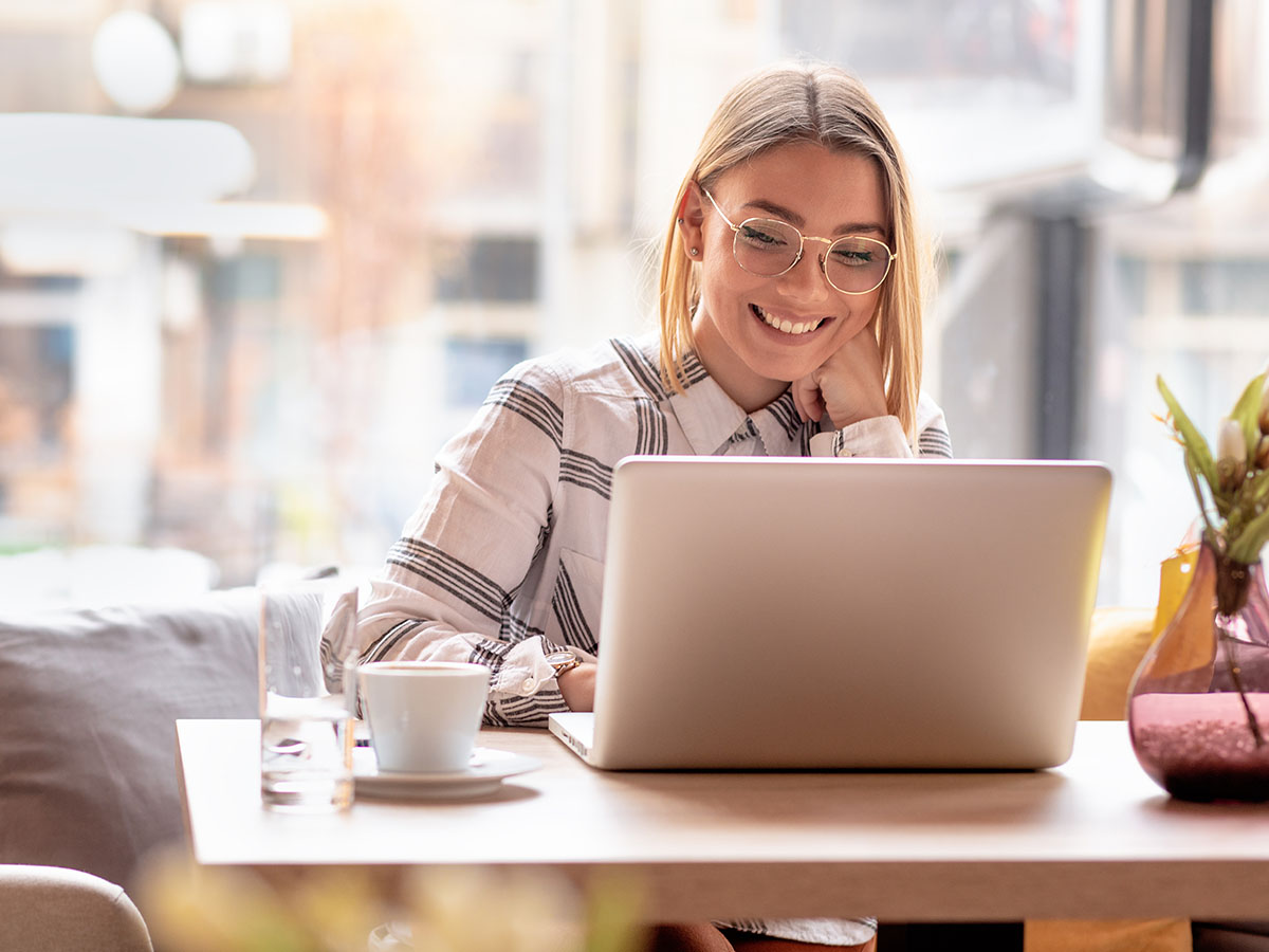 Woman smiling over laptop