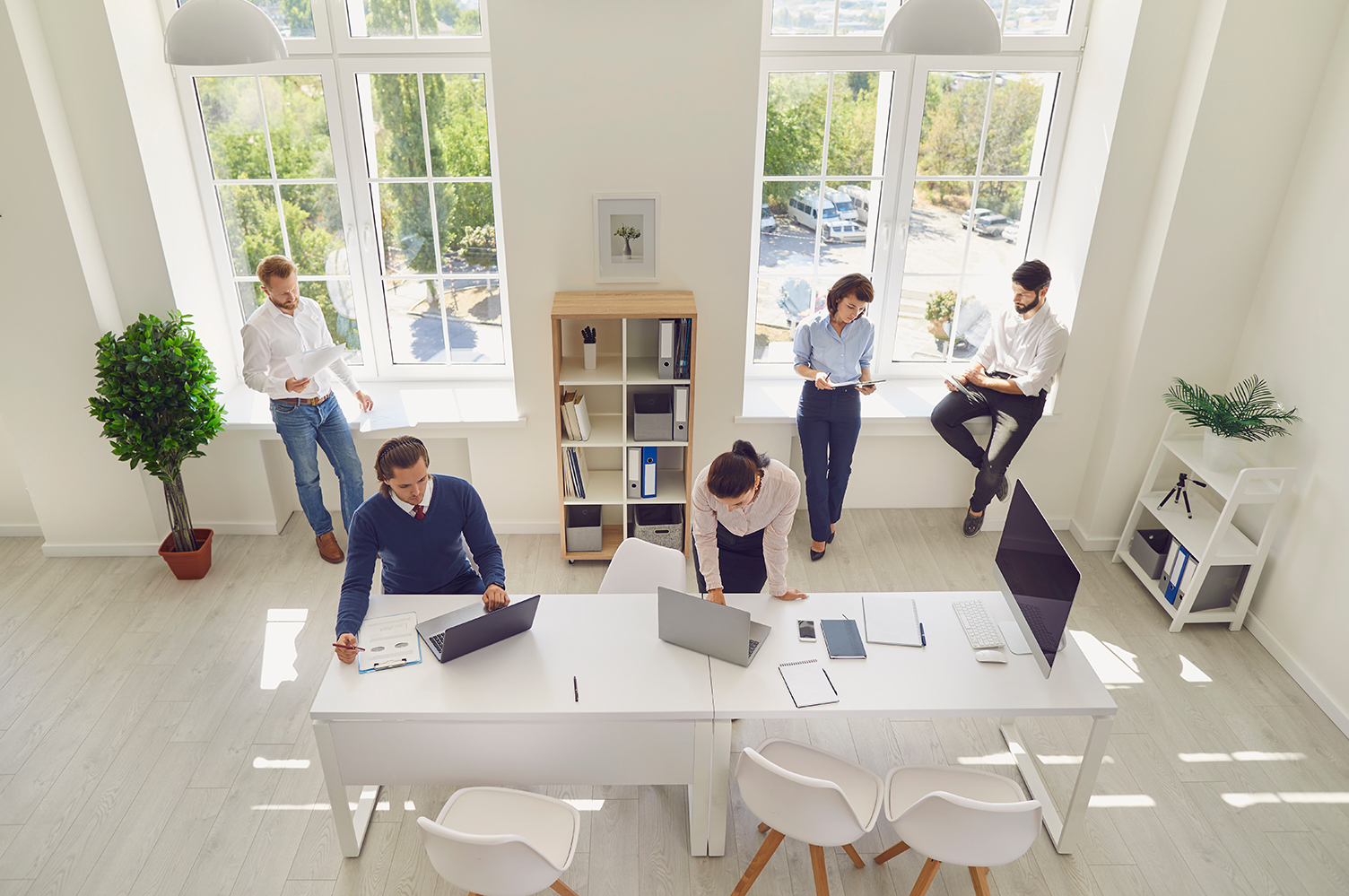 People standing around office