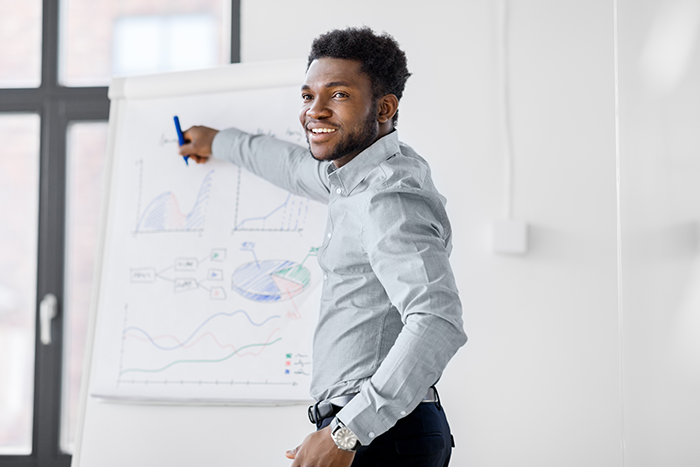 businessman with flip chart at office presentation