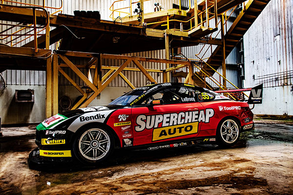 image of a race car in a manufacturing warehouse setting