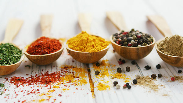 Wooden spoons with assortment of spices