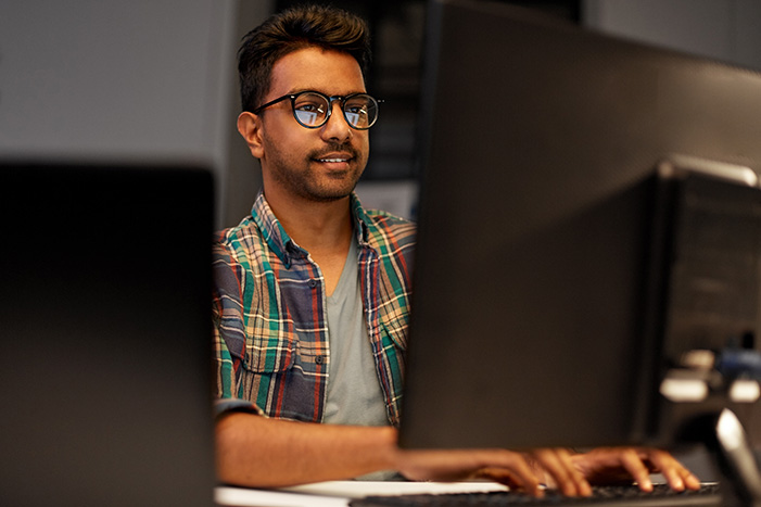 close up of creative man working at night office