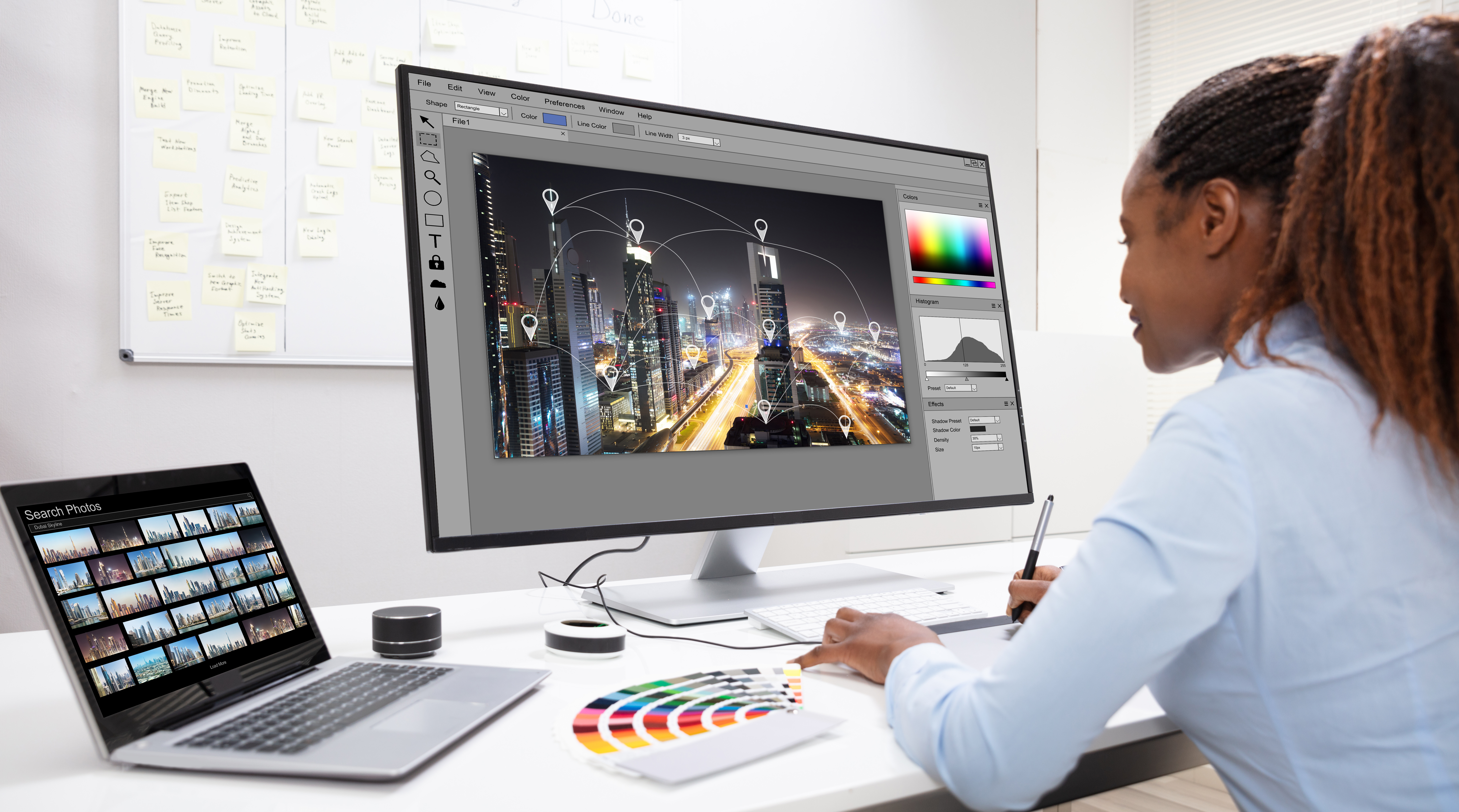 Designer Editing Photos On Computer