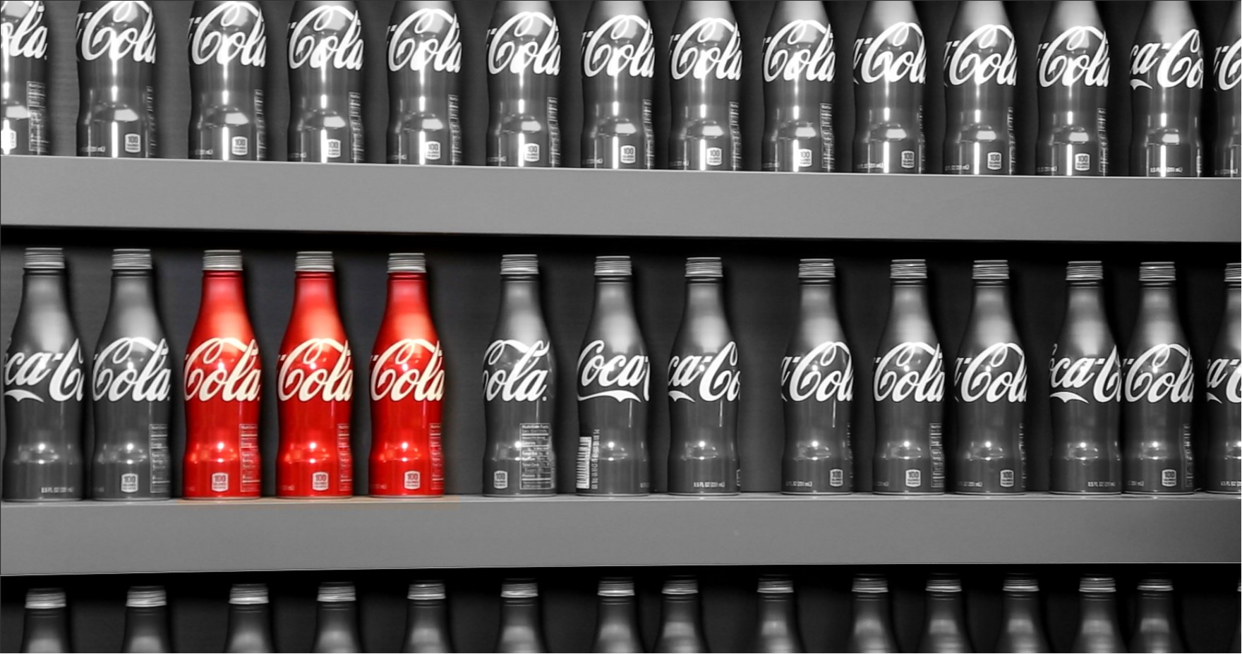 Coca-cola bottles on a shelf