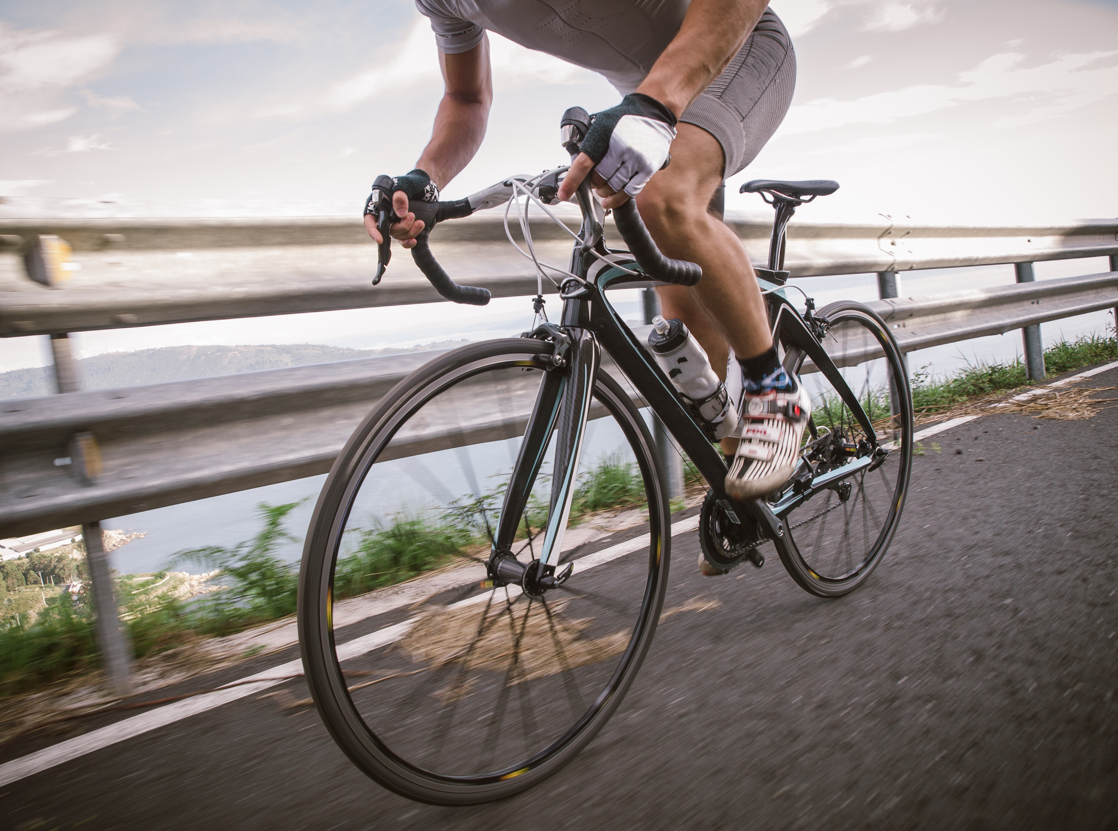 Detail of a road bike with a cyclist pedaling