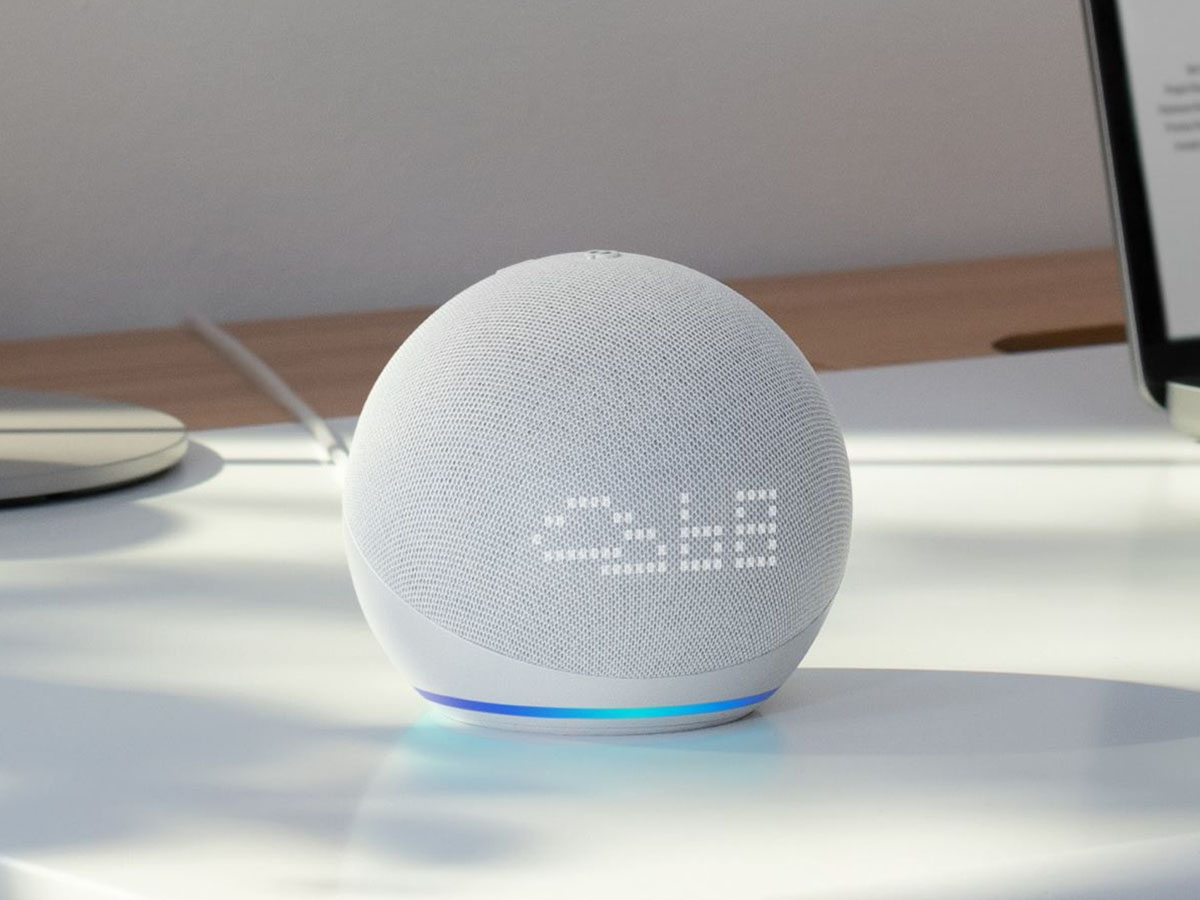 White Amazon Echo device on a desk