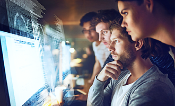 team of people working at a computer