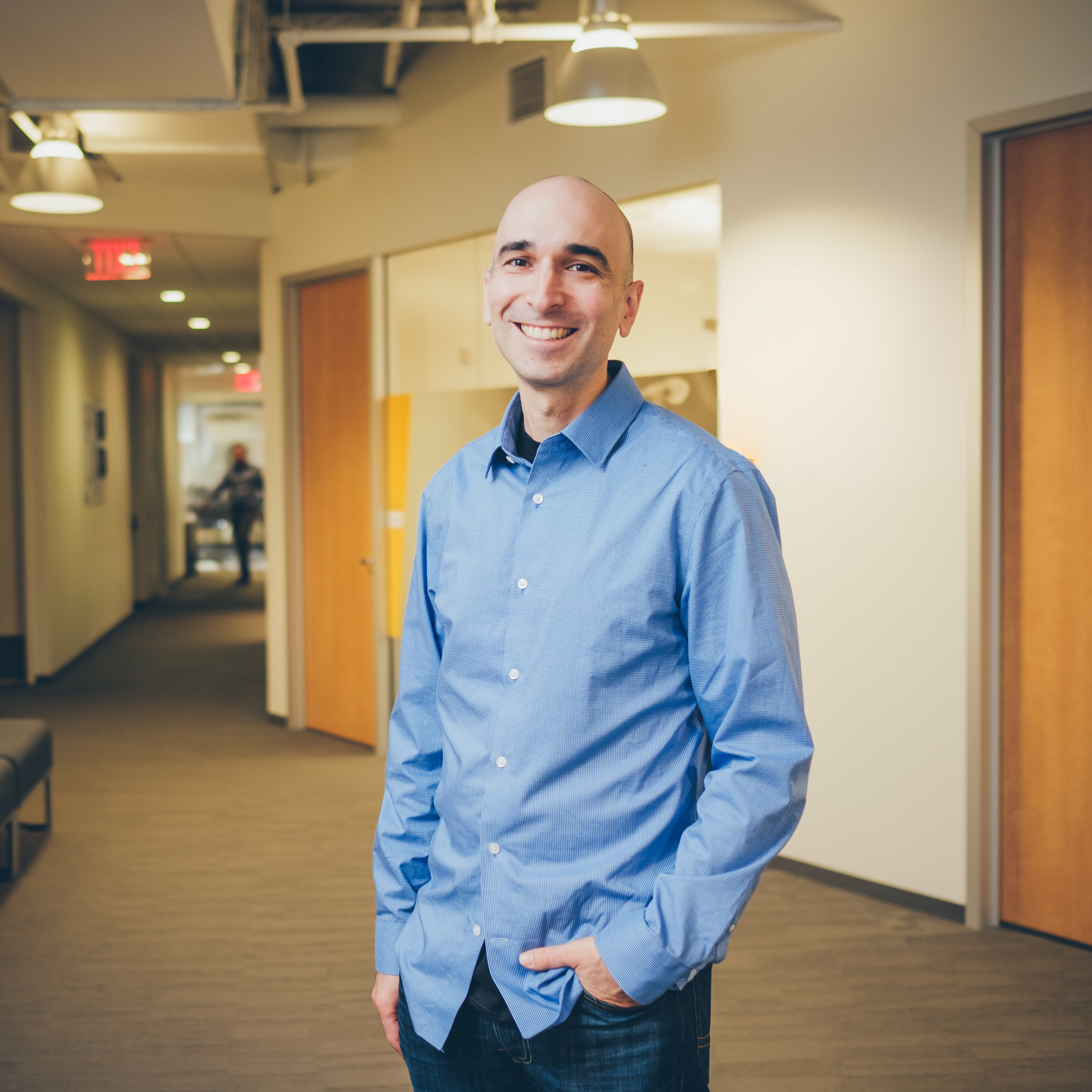 Image of Eric Forseter, an AWS senior sales manager and EQ evangelist, standing in an office.