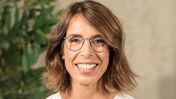 Suzana Curic, Head of Enterprise at AWS, smiles for the camera in a head shot.