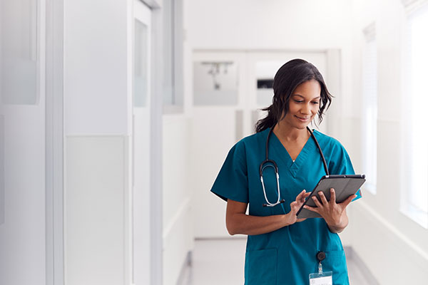 Woman in teal medical scrubs