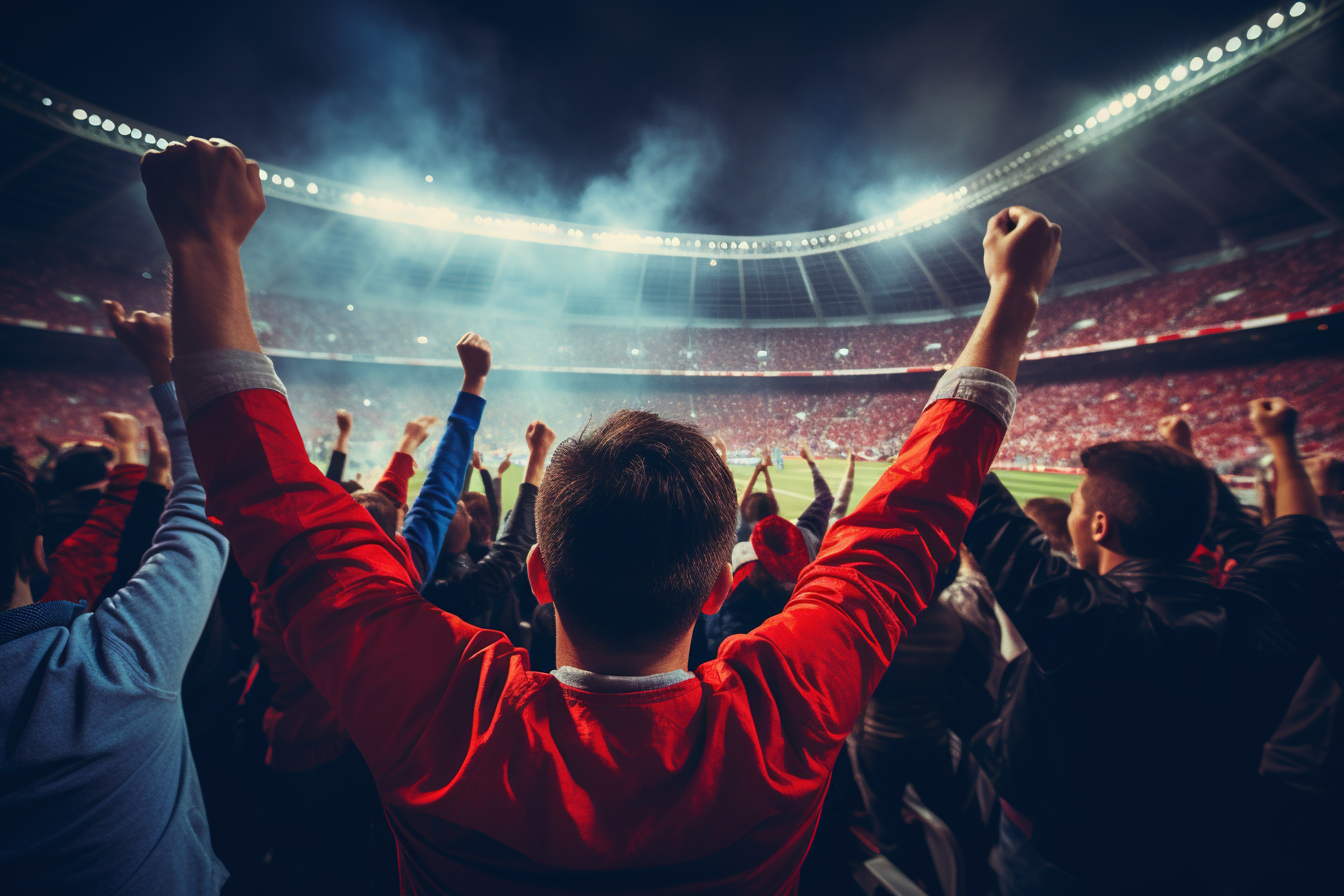 Fans are cheering in a soccer stadium