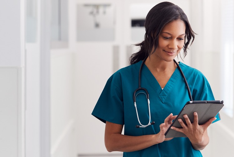 Photo of female doctor with computer tablet