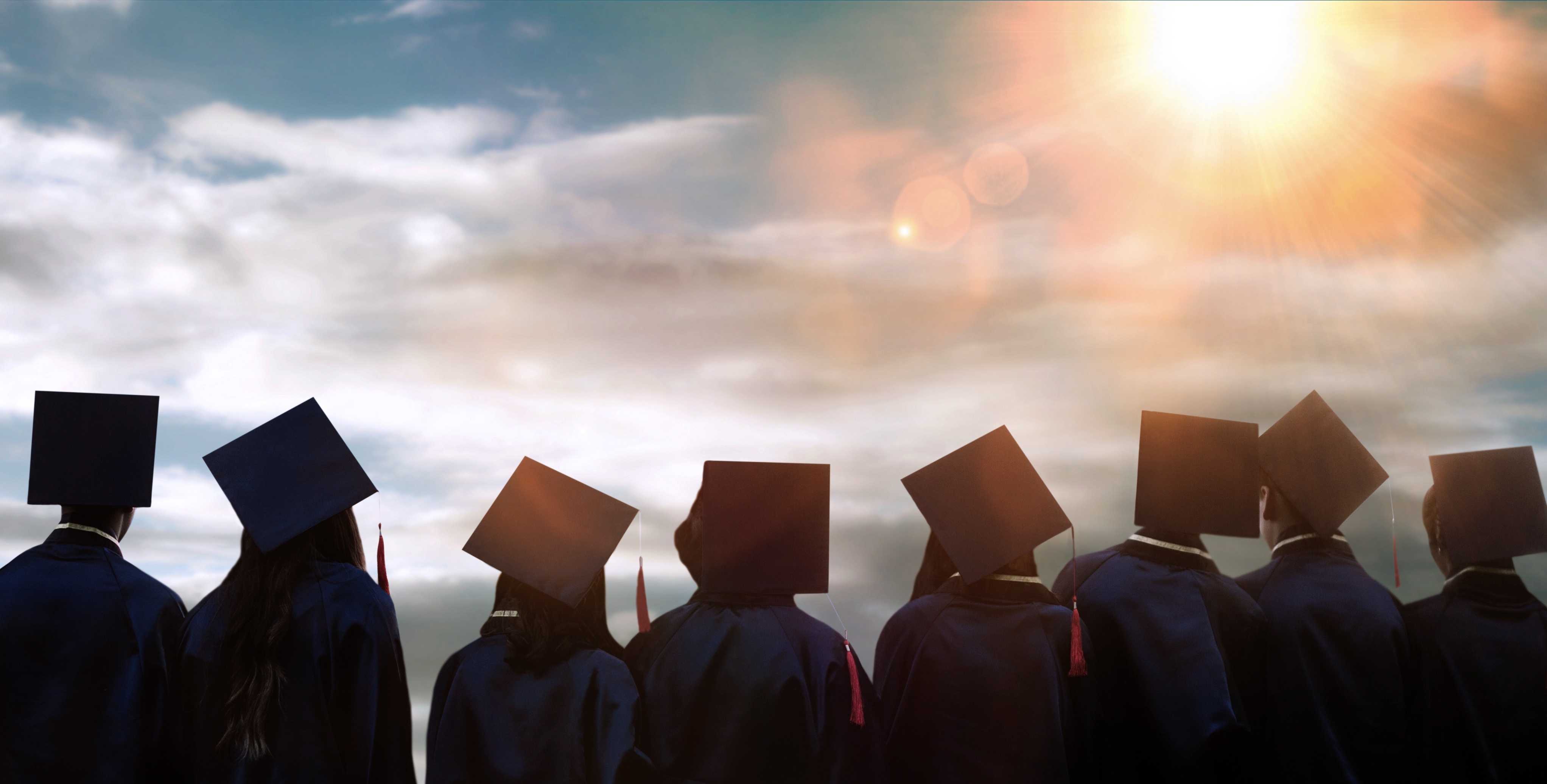 graduated students with graduation hat