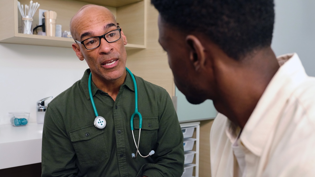 doctor speaking with patient in an exam room