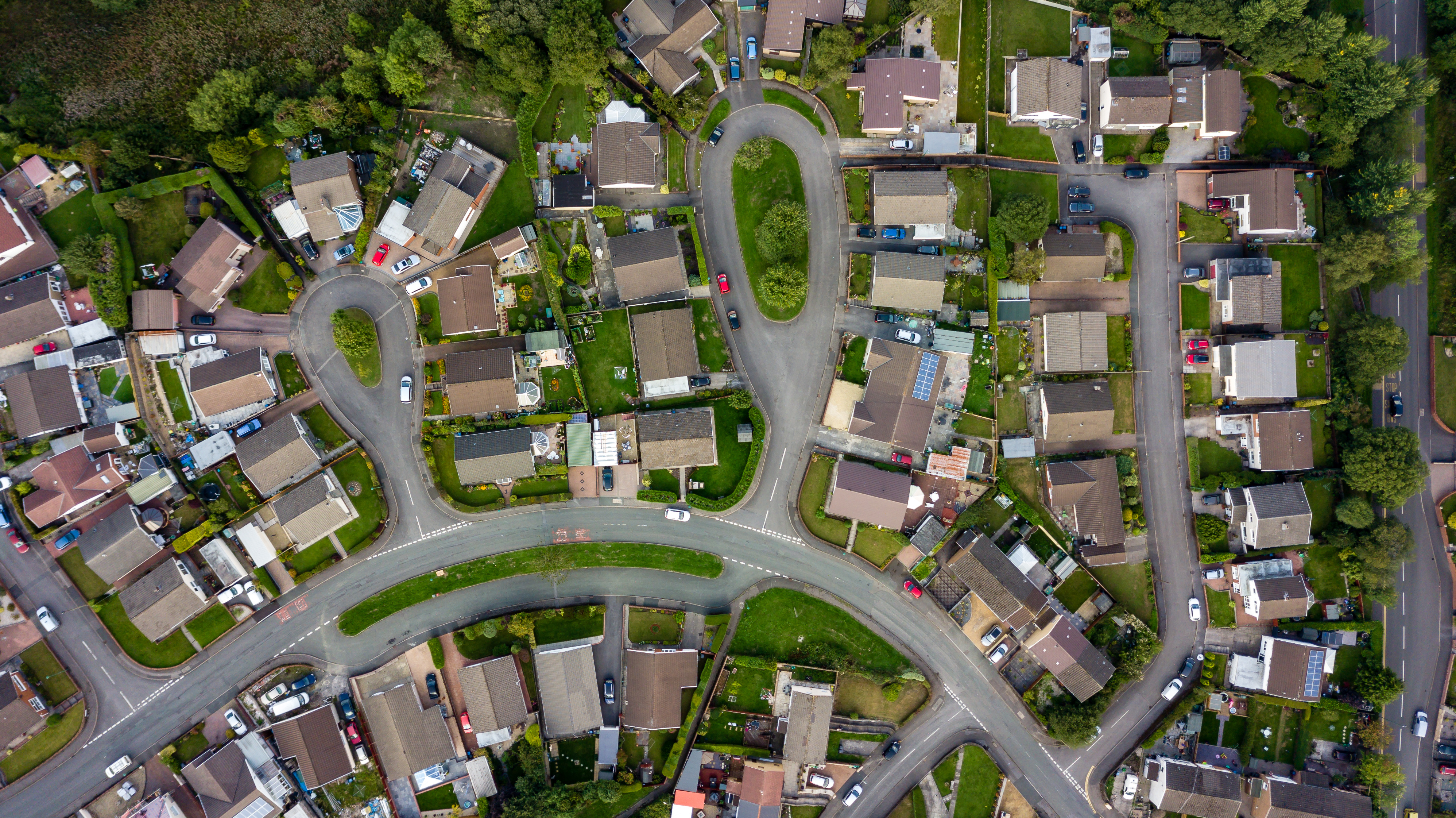 Top down aerial view of urban houses and streets in a residential area of a Welsh town