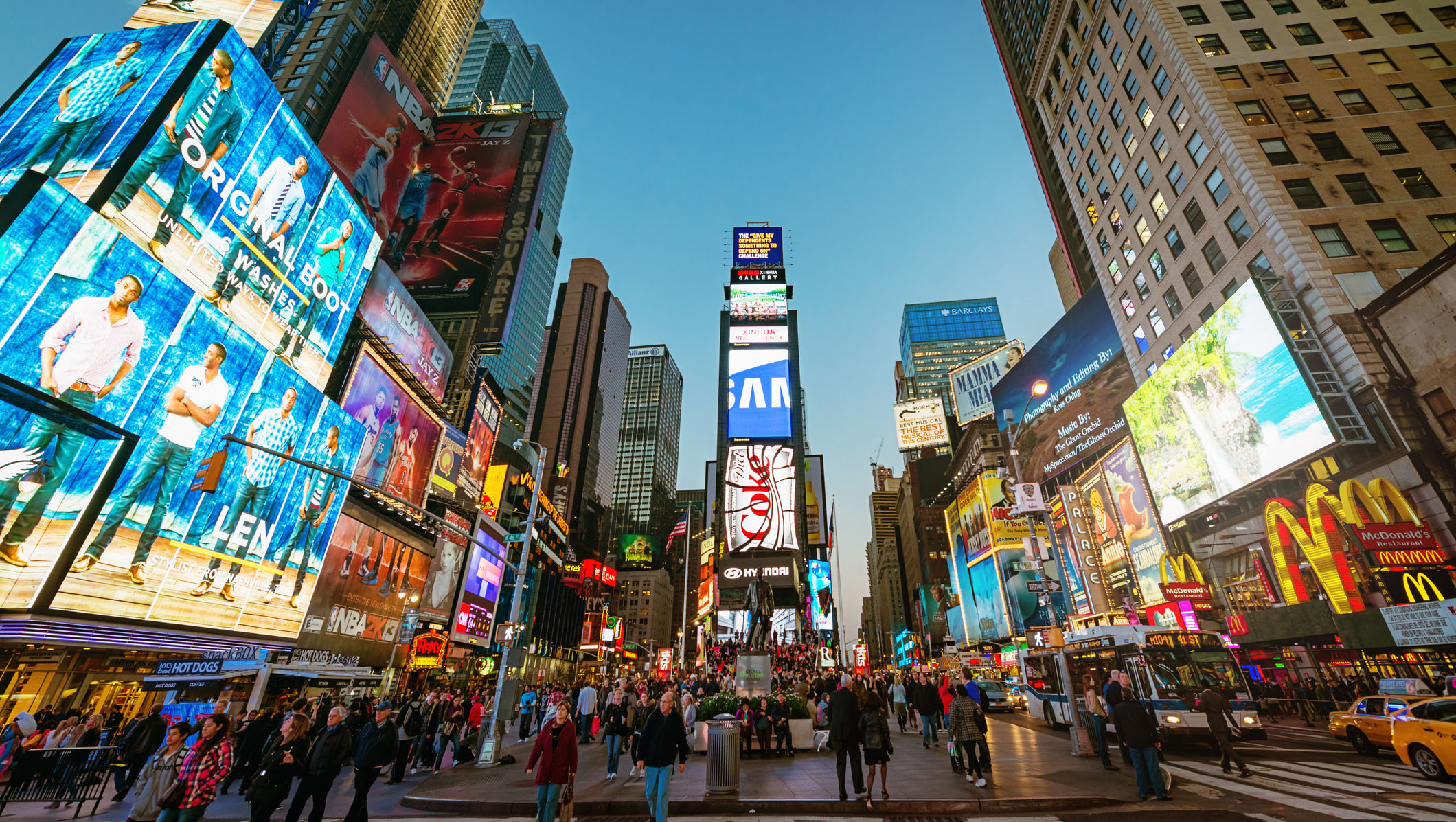 Amazing vibrant Times Square crowded with tourists and people sightseeing. New York City, Manhattan, USA.