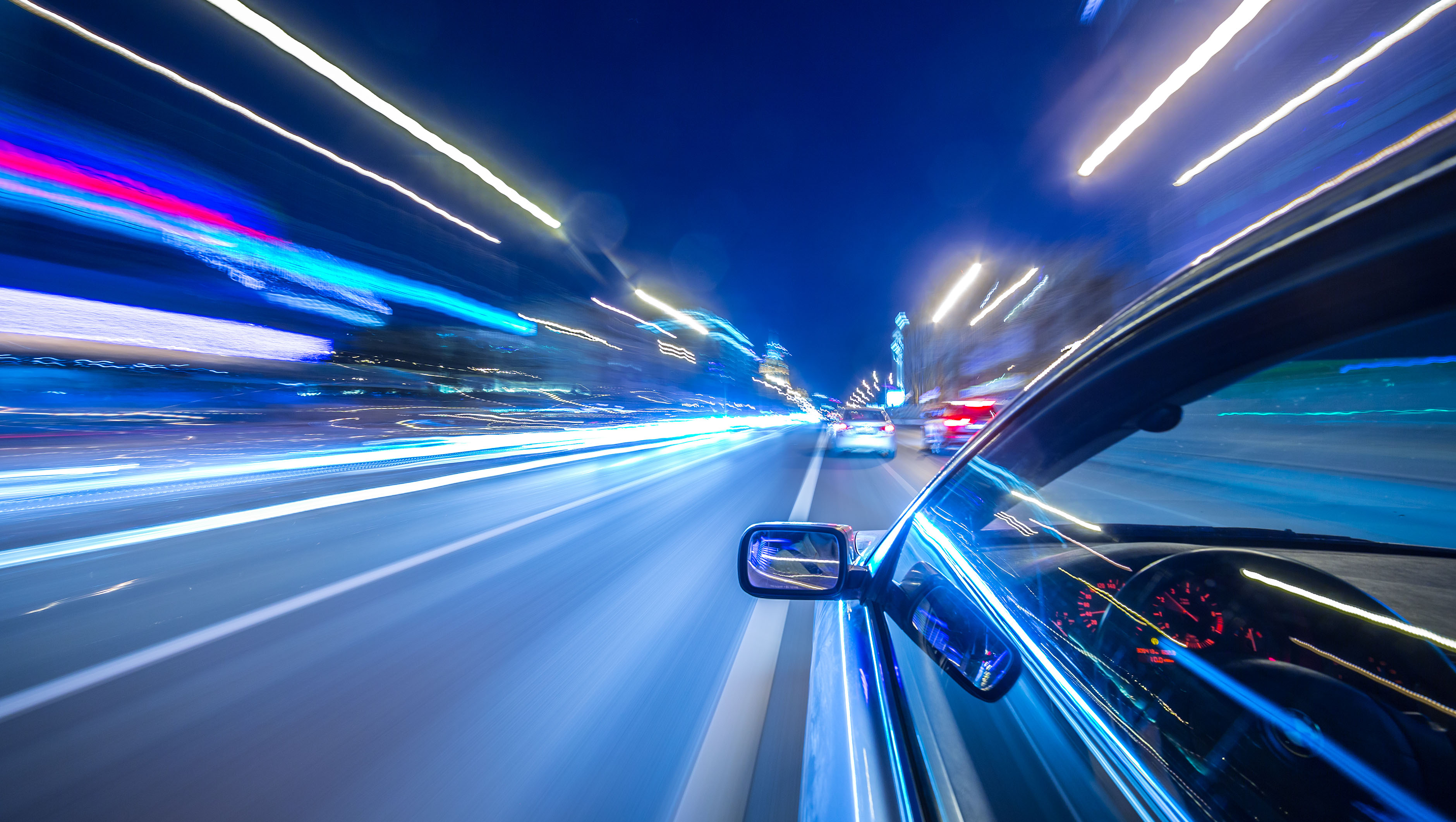 The car moves at great speed at the night. The car moves at great speed at the night.