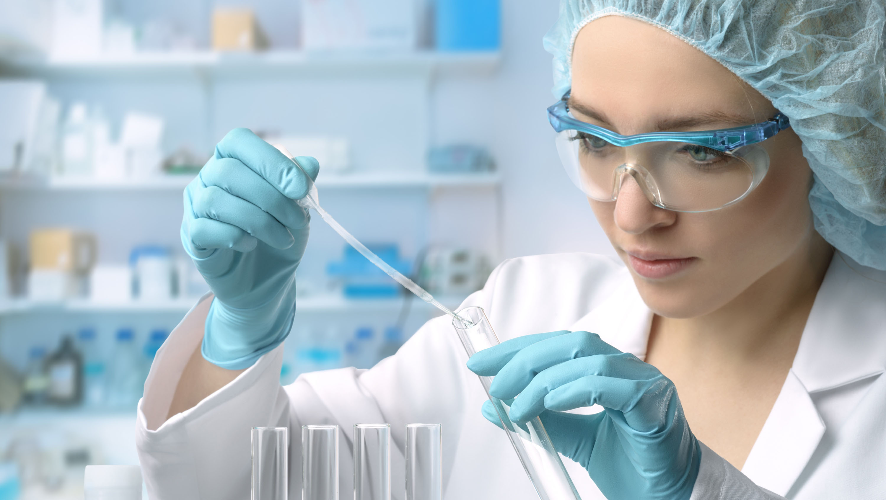 Photo of pharma scientist with test tubes