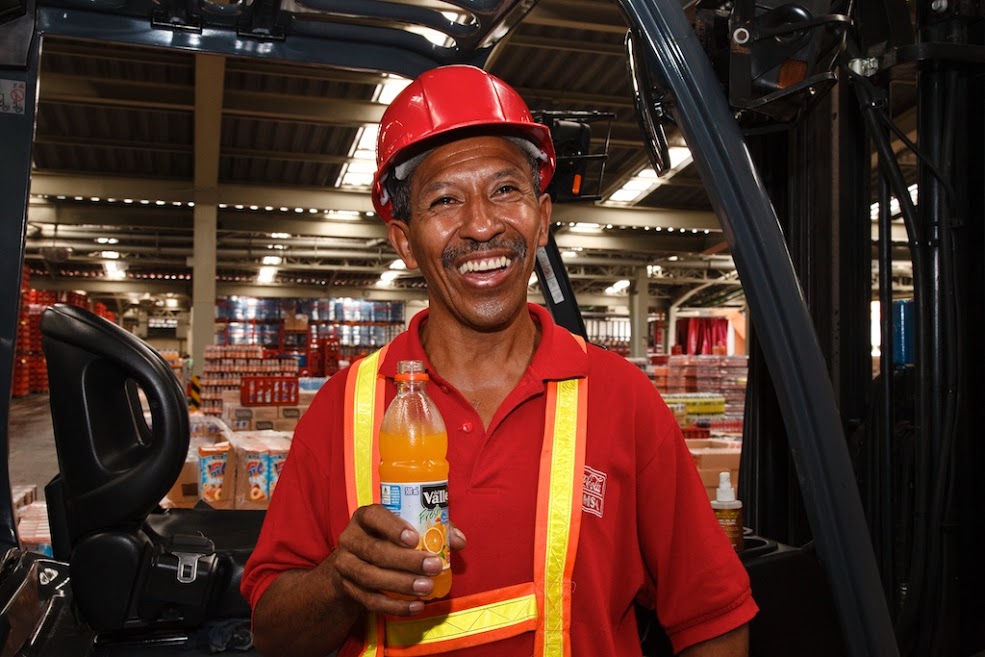 Smiling Coca-Cola employee