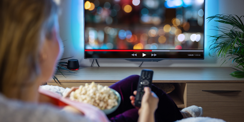 stock image of person watching TV