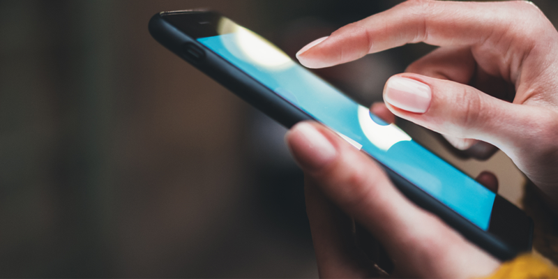 stock image of person using phone