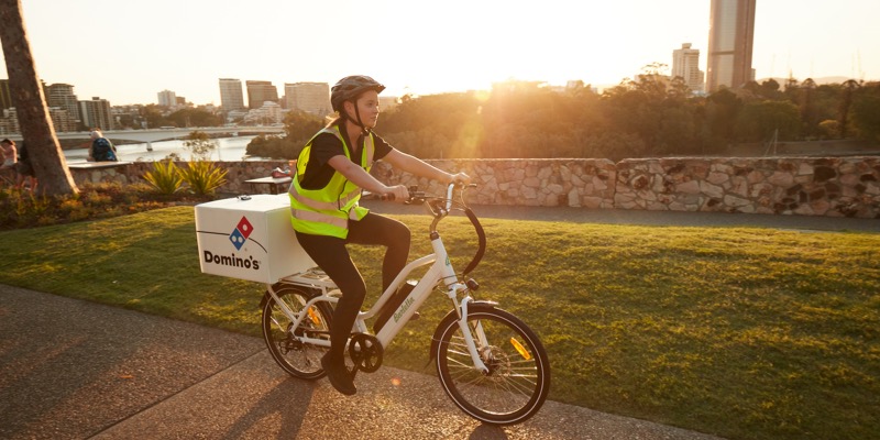 Domino’s Pizza Enterprises Delivers in Record Time Using AWS for Predictive Ordering Domino's delivery biker