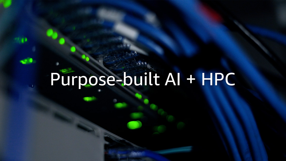 Close-up of data center server racks with blue network cabling and green status lights, overlaid with the words Purpose-built AI + HPC