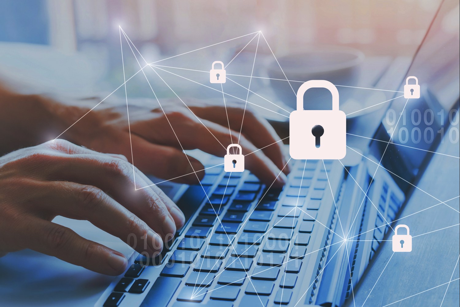 Hands typing on a laptop overlaid with padlock icons representing data security and regulatory compliance