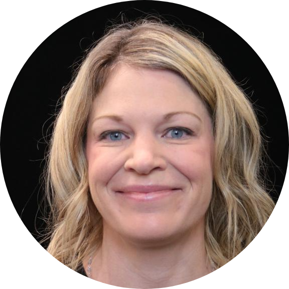 Portrait of a woman with blonde hair against a black background (circle crop)