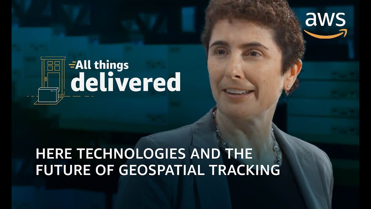 YouTube thumbnail for an AWS video titled 'HERE Technologies and the Future of Geospatial Tracking', featuring a person speaking, with the 'All things delivered' branding and AWS logo.