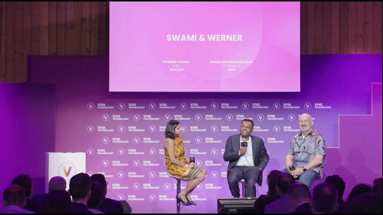 Thumbnail image from the Viva Technology conference panel featuring 'Swami & Werner' with speakers on stage in front of a branded background. The panel includes a title slide with names and titles, and an audience in the foreground.