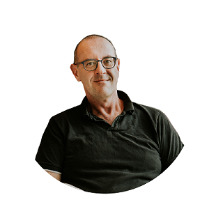 Portrait of an AI and machine learning expert, featuring a person wearing glasses and a black shirt, set against a transparent background.