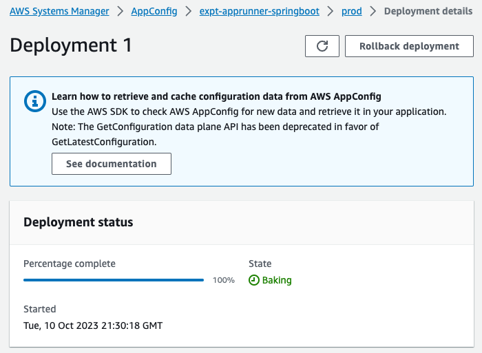 Screenshot of the AWS AppConfig Deployment details page displaying Deployment 1 with deployment status 'Baking' and 100% completion, including information about retrieving configuration data.