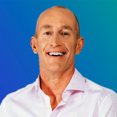 A person wearing a white collared shirt against a blue gradient background.