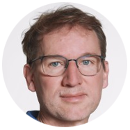 2A person with short brown hair against a white background.