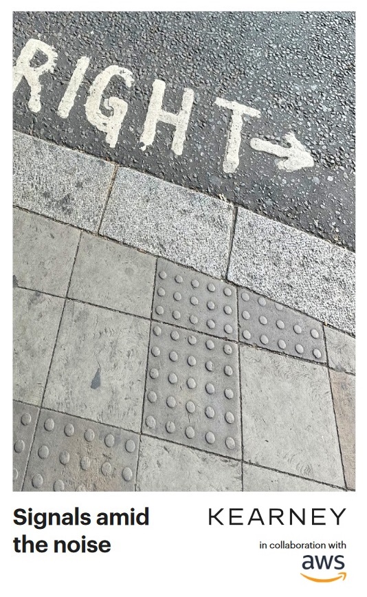 "Sidewalk with tactile paving and a road marking reading 'RIGHT' with an arrow, accompanied by the text 'Signals amid the noise' and logos for Kearney and AWS."