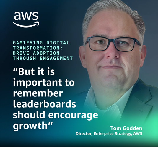 Alt-text: AWS promotional graphic with the text "Gamifying Digital Transformation: Drive Adoption Through Engagement" and a quote, "But it is important to remember leaderboards should encourage growth," attributed to Tom Godden, Director, Enterprise Strategy, AWS.