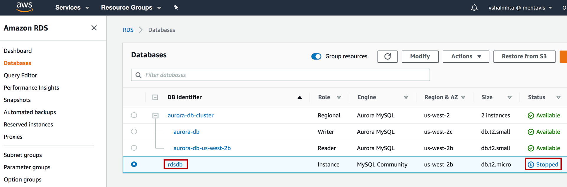 AWS RDS console showing a list of databases, with one MySQL instance named "rdsdb" highlighted and its status marked as "Stopped."