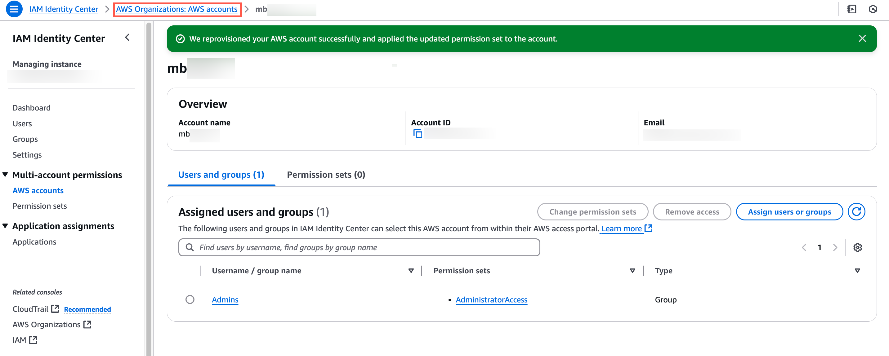 AWS Identity Center interface showing account details, assigned users and groups, and permission settings with a success message indicating account reprovisioning.