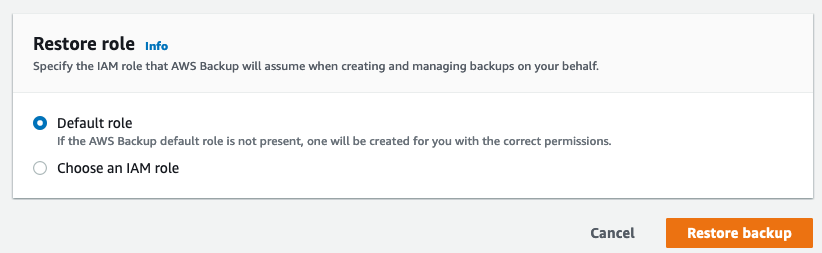 "Restore role selection screen in AWS Backup with options for 'Default role' or 'Choose an IAM role,' and buttons for 'Cancel' and 'Restore backup.'"