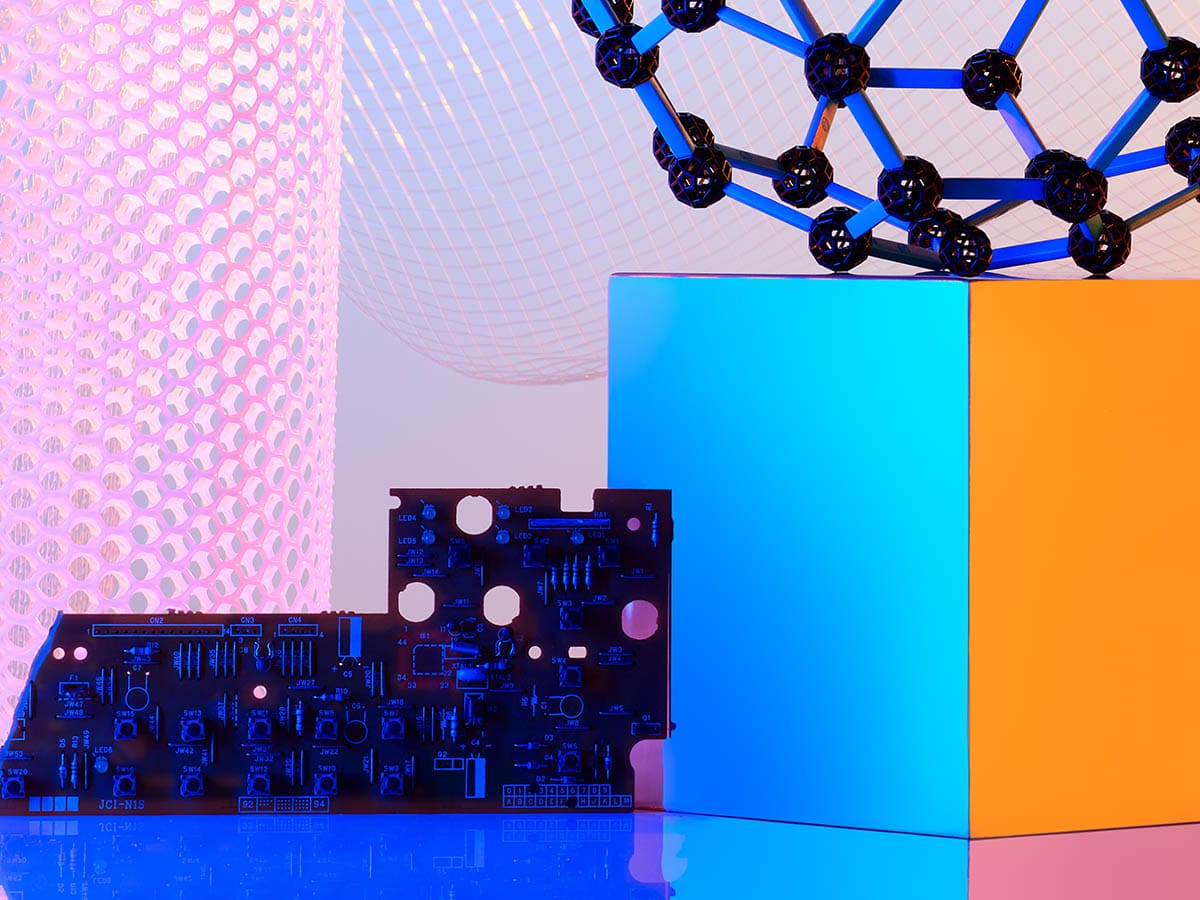 Abstract image featuring technology components such as a circuit board and geometric shapes, highlighted with colorful lighting, representing concepts in telecommunications and modern technology.
