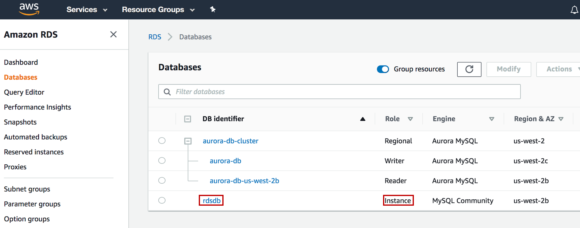 Amazon RDS dashboard showing a list of databases with identifiers, roles, engines, and regions, highlighting "rdsdb" as an instance.