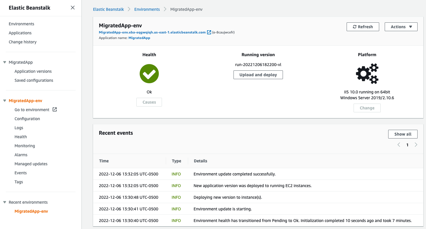 Screenshot of the AWS Elastic Beanstalk console showing the deployment status and environment health for a migrated ASP.NET web application running on IIS 10.0 with Windows Server 2019. The image displays application version, platform details, and recent environment events.